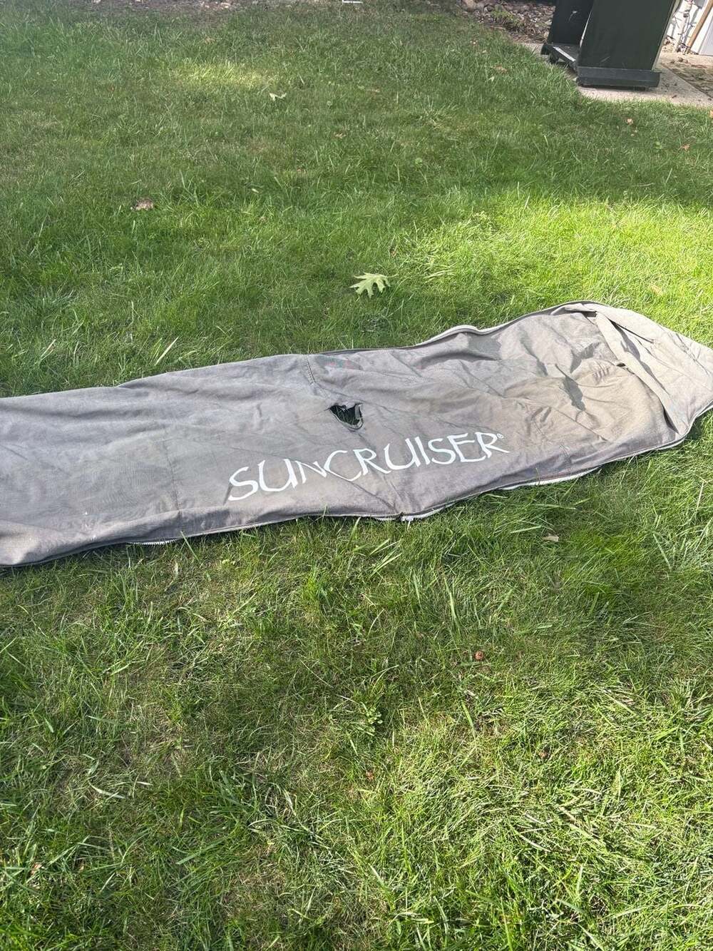 SunCruiser Gray Boat Enclosure Cover with Hole Damage